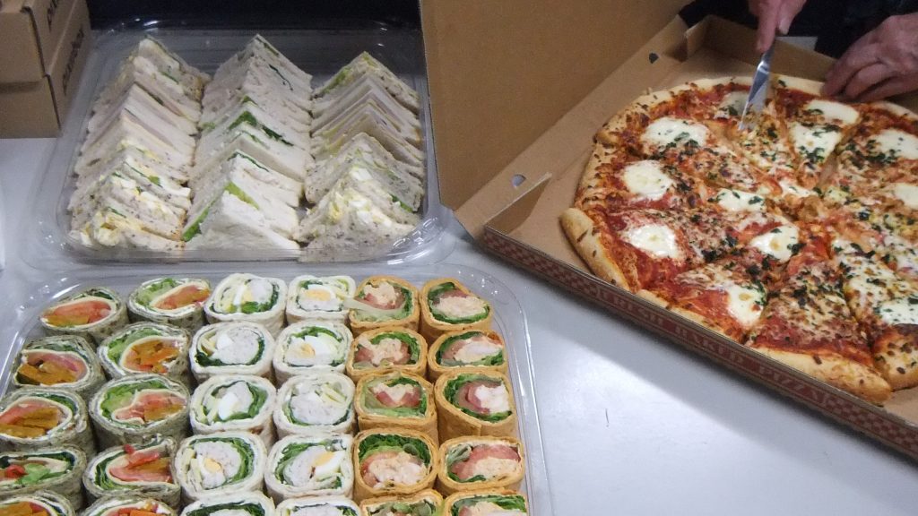 The feast provided - pizza and sandwiches