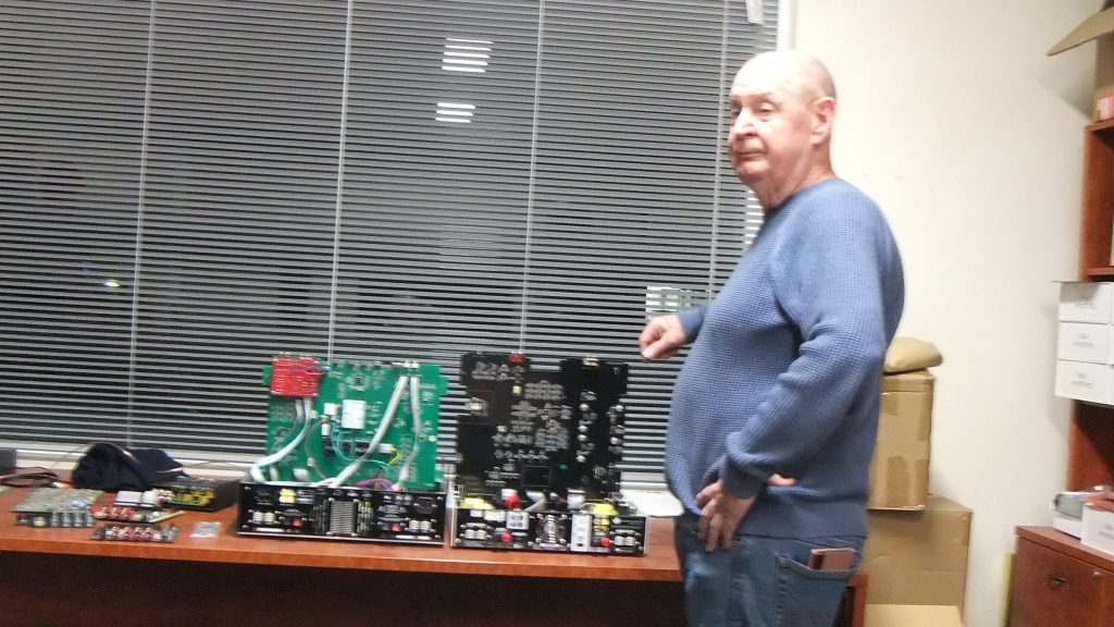 Wayne Cary standing beside the Y4 amplifiers